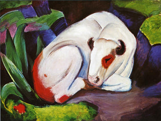 A white bull with a red spot of fur around his eye peacefully curled up and nestled in a green field